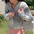 Damenweste aus Zopfmusterstrick mit Knöpfen Damenpullover