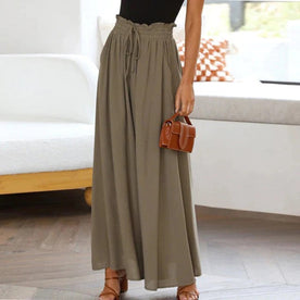 skirts : Jade – Pantalon palazzo ample à jambes larges et taille haute in Vert van Seroa