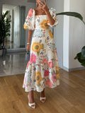Robe midi élégante, manches bouffantes et imprimé floral