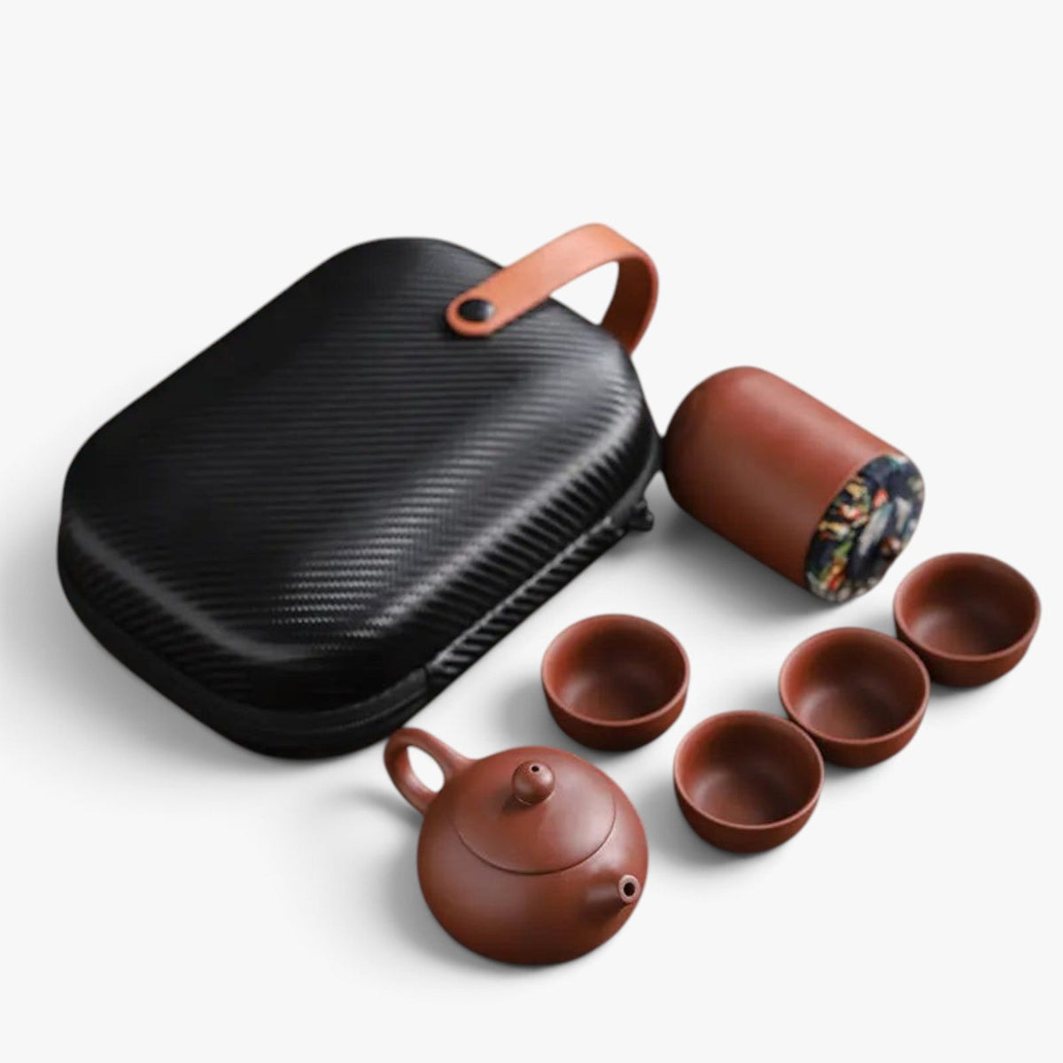 Roselva traditional travel tea set with brown ceramic teapot, four cups, storage jar, and black protective case.
